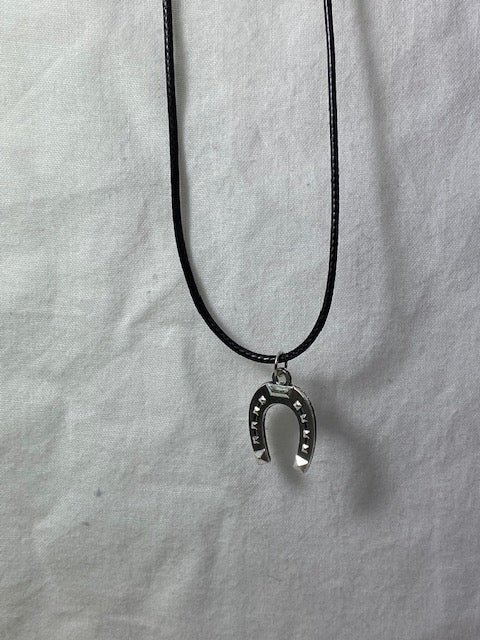 Black rope necklace with horse shoe